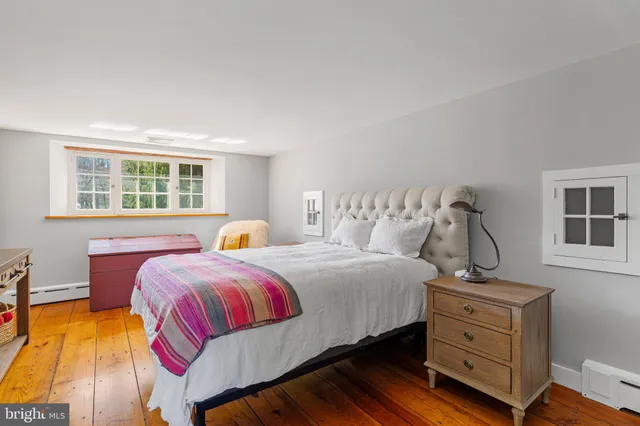 a living room with lots of furniture and kitchen view