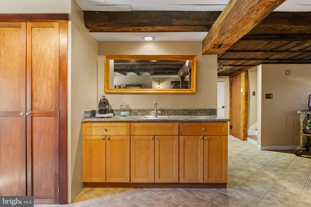 a view of a chairs and table in the balcony