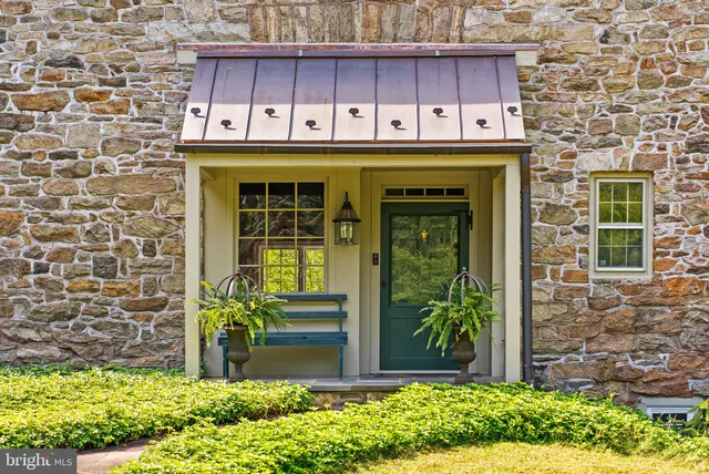 a front view of a building with garden
