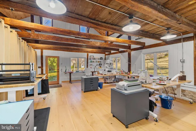 a view of a house with wooden fence