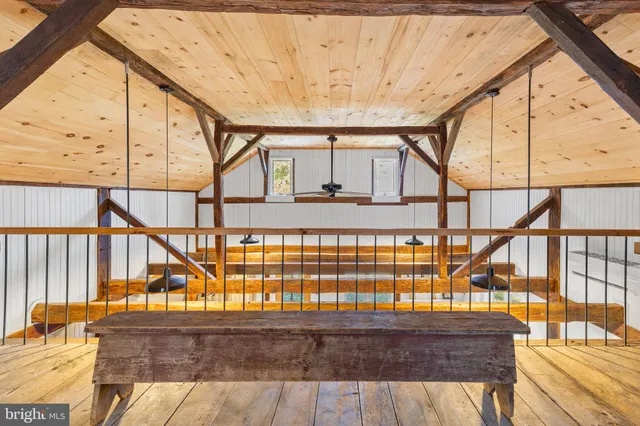 an aerial view of a house with yard swimming pool and outdoor seating