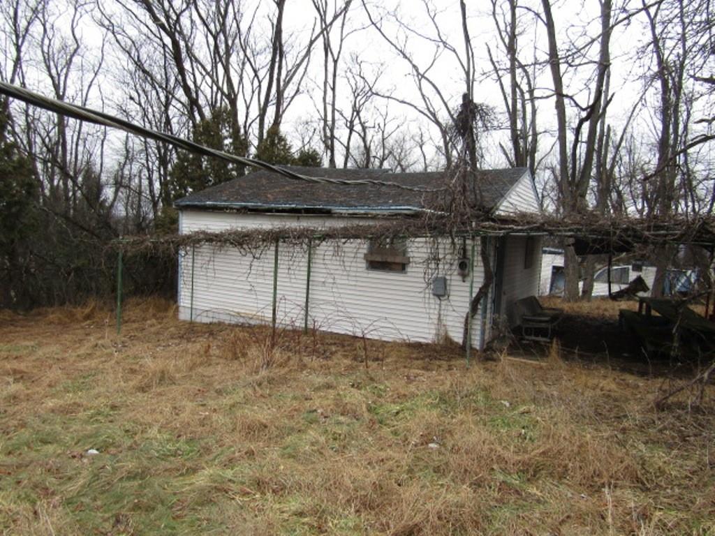232 Crestview Road Pittsburgh, PA 15235 - Photo 19 of 30 a view of a house with a large tree and wooden fence