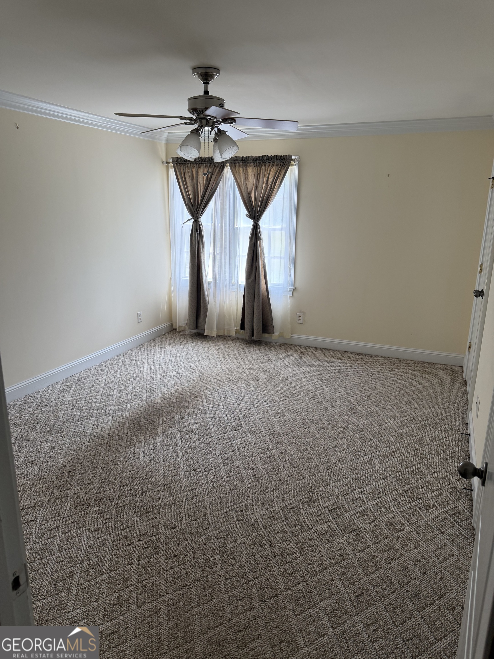 302 Norris Road Barnesville, GA 30204 - Photo 57 of 65 a view of empty room with wooden floor and fan