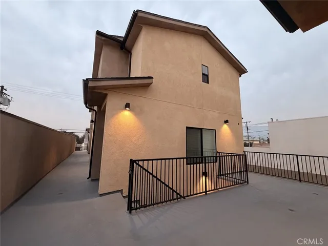 a view of a house with iron fence