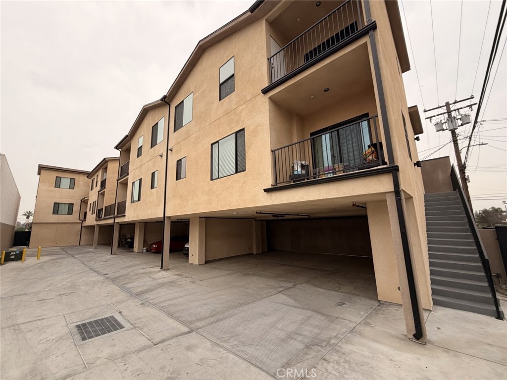 511 North Azusa Avenue, Unit 203 Azusa, CA 91702 - Photo 2 of 16 a view of a house with a balcony