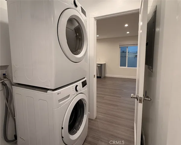 a view of a hallway with washer and dryer