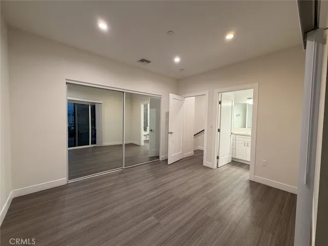 a view of wooden floor and windows in an empty room