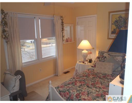 27 Cartwright Drive West Windsor, NJ 08550 - Photo 11 of 14 a living room with furniture and a window