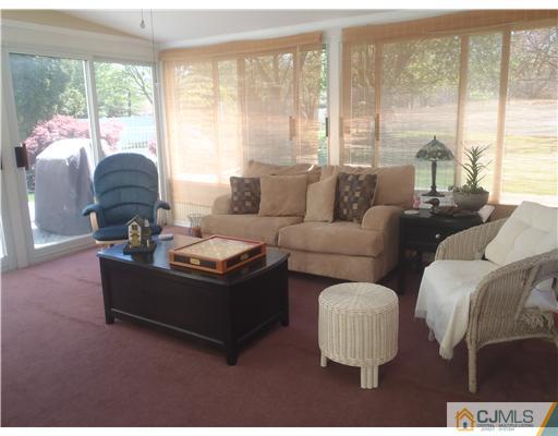 27 Cartwright Drive West Windsor, NJ 08550 - Photo 13 of 14 a living room with couches and a large window