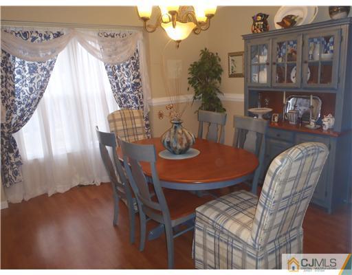 27 Cartwright Drive West Windsor, NJ 08550 - Photo 5 of 14 a dining room with furniture and wooden floor