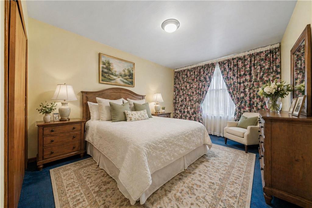 665 Main Street Irwin, PA 15642 - Photo 8 of 28 1st floor Primary Bedroom *digitally Staged*