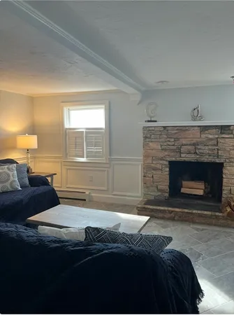 a view of a dining room with furniture and window