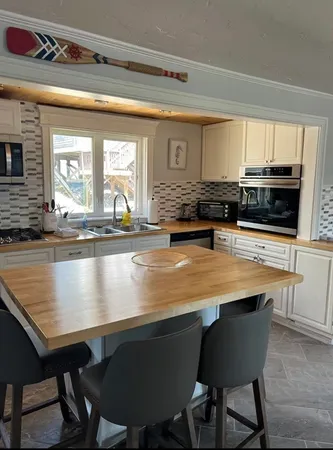 a view of a dining room with furniture and window