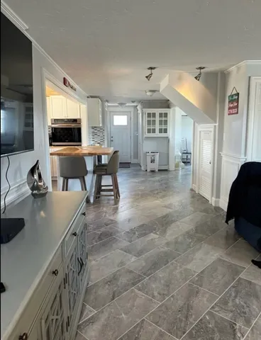 a bedroom with a bed and a night stand