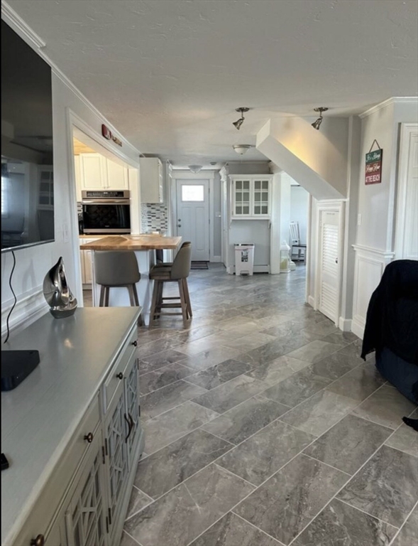 300 Ocean Street Marshfield, MA 02050 - Photo 16 of 30 a living room with furniture and a flat screen tv