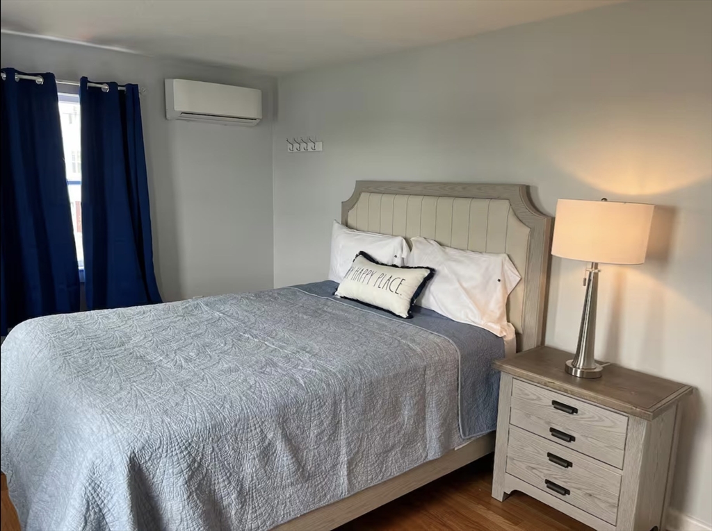 300 Ocean Street Marshfield, MA 02050 - Photo 17 of 30 a bedroom with a bed and a night stand