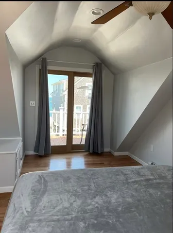a bedroom with a bed and window