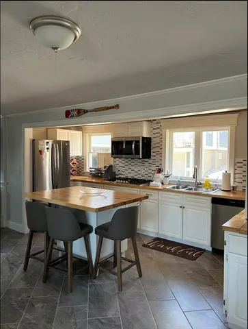 a view of hallway with wooden floor