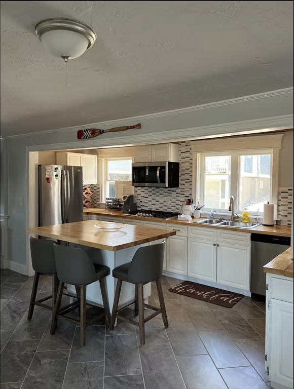 300 Ocean Street Marshfield, MA 02050 - Photo 26 of 30 a kitchen with a sink and chairs