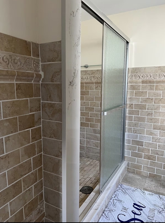 300 Ocean Street Marshfield, MA 02050 - Photo 29 of 30 a bathroom with a glass shower door