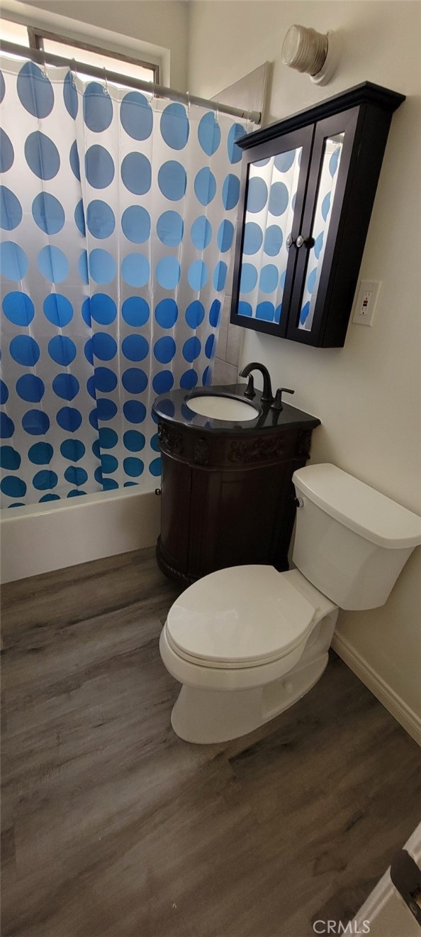 1337 Constance Street, Unit 5 Los Angeles, CA 90015 - Photo 3 of 4 a bathroom with a toilet and a mirror