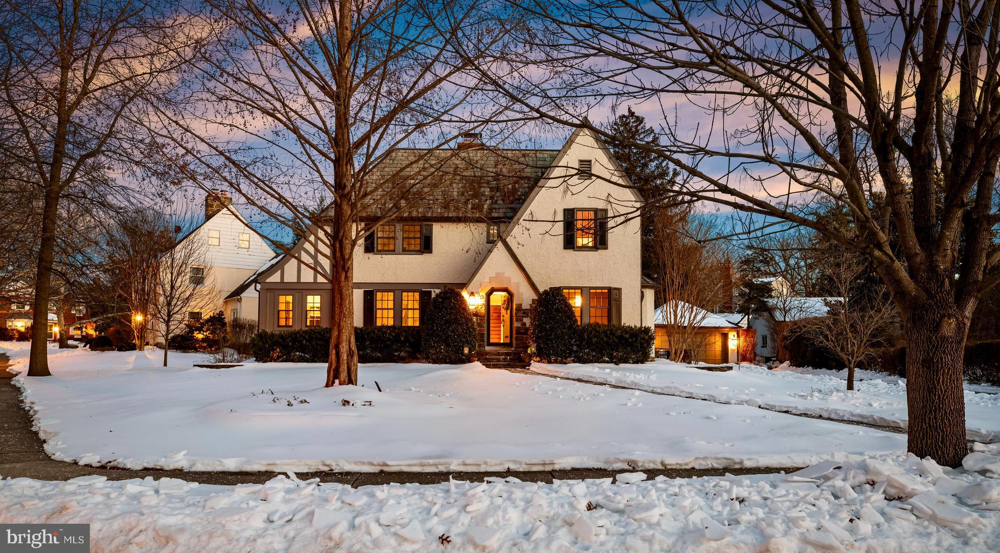 a view of outdoor space covered with snow in front of house