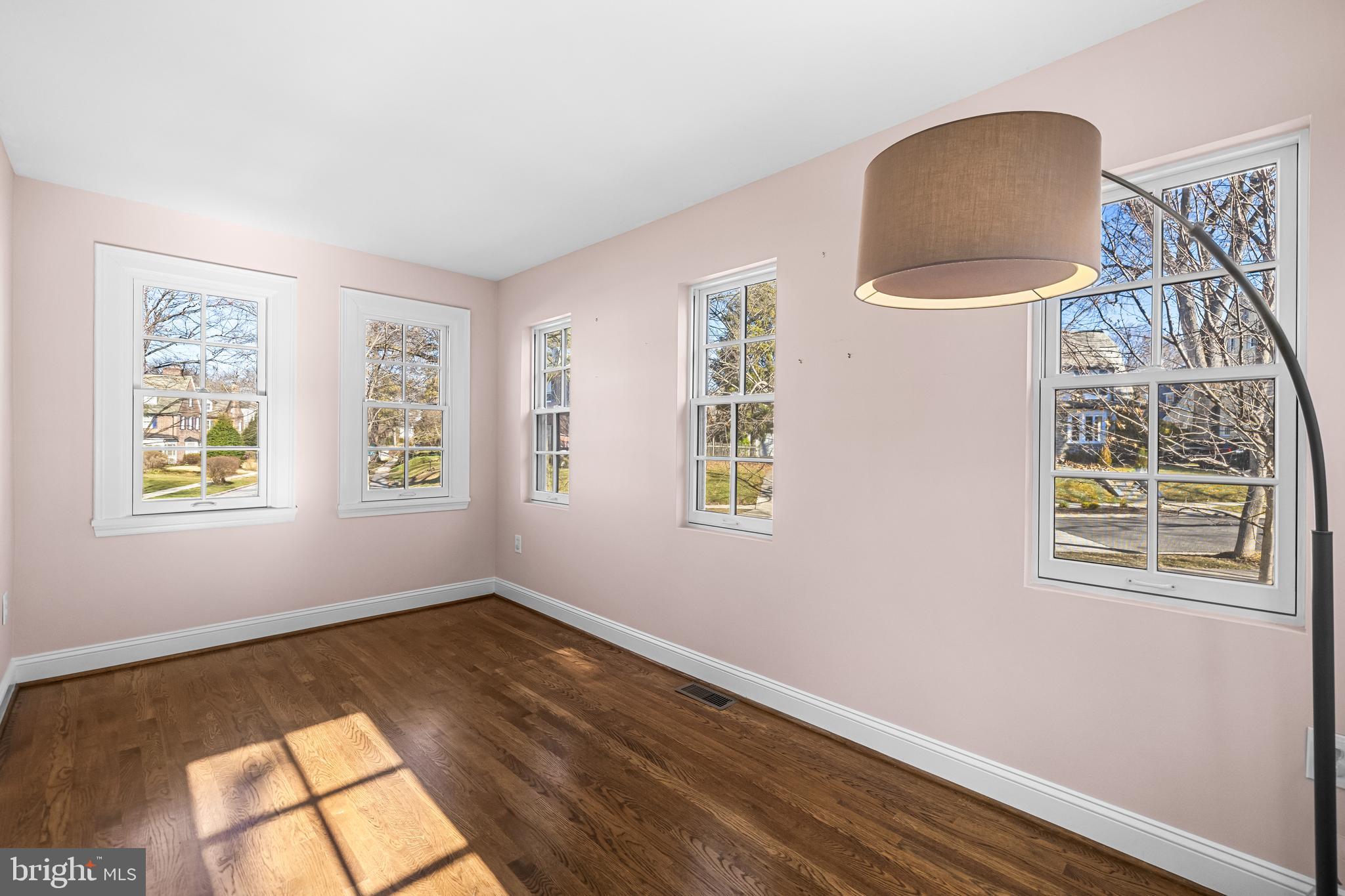 307 East Highfield Road Baltimore, MD 21218 - Photo 14 of 59 wooden floor in an empty room with a window