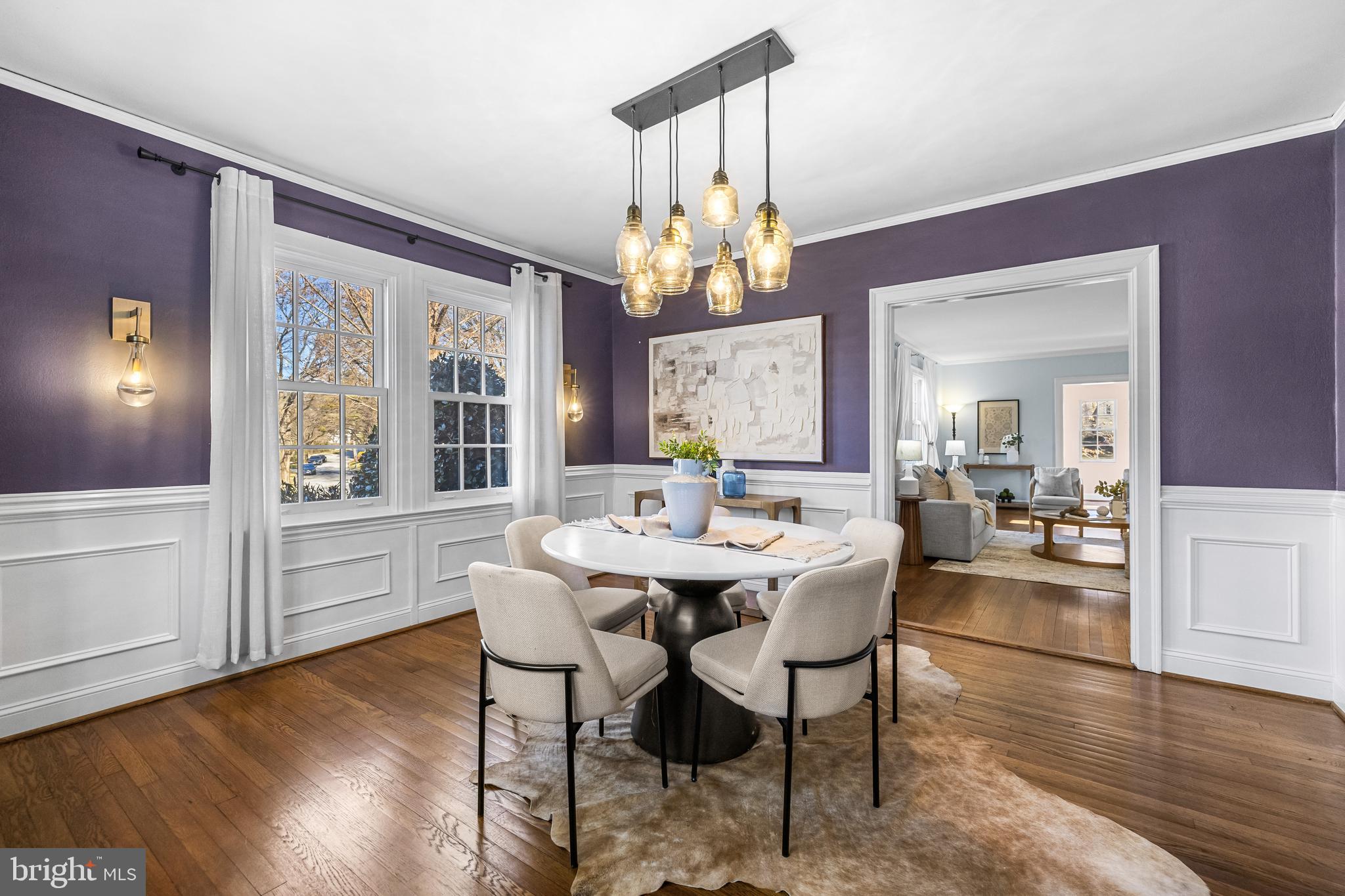 307 East Highfield Road Baltimore, MD 21218 - Photo 17 of 59 a view of a dining room with furniture wooden floor and chandelier