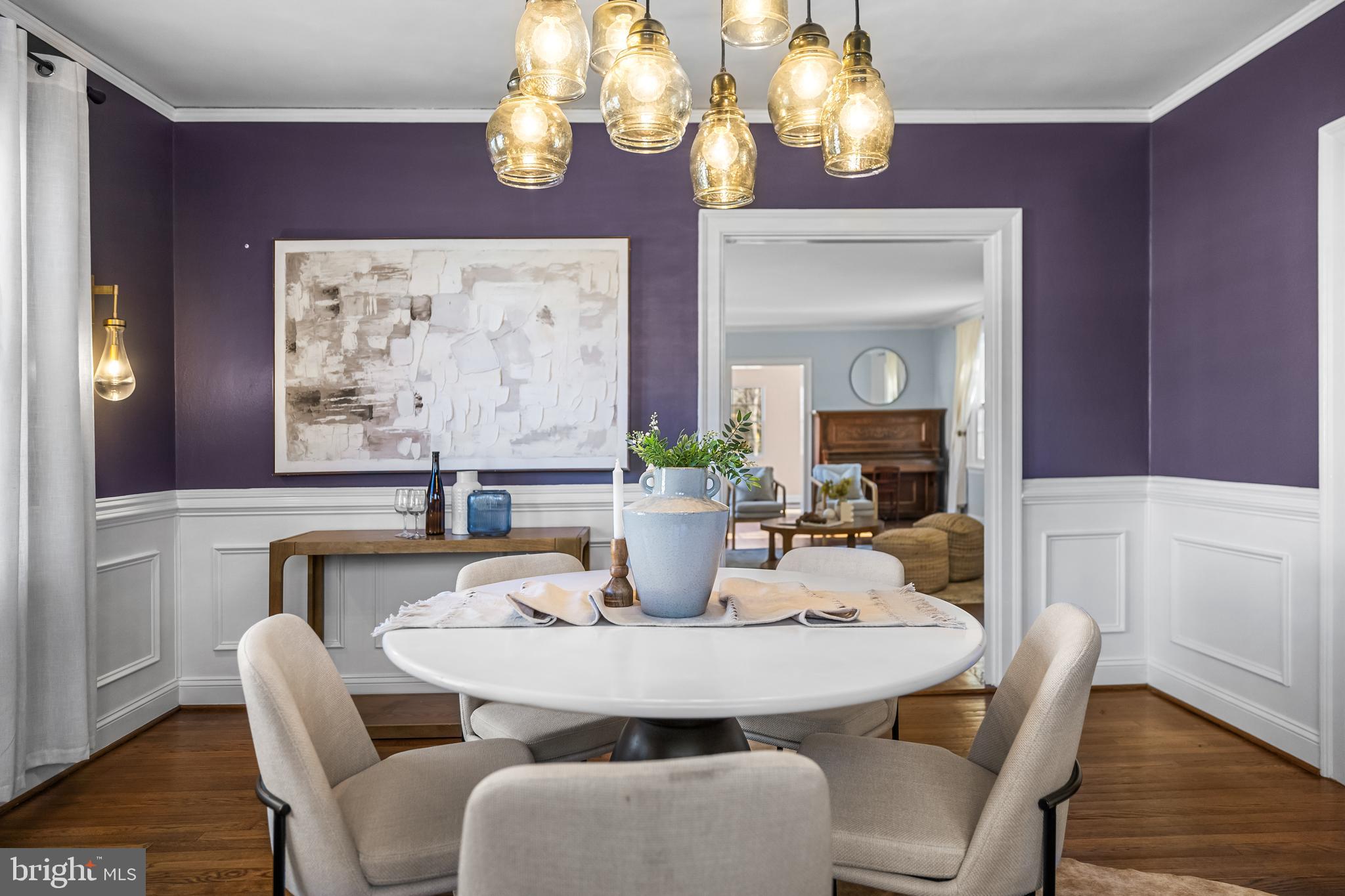 307 East Highfield Road Baltimore, MD 21218 - Photo 19 of 59 a view of a dining room with furniture wooden floor and chandelier