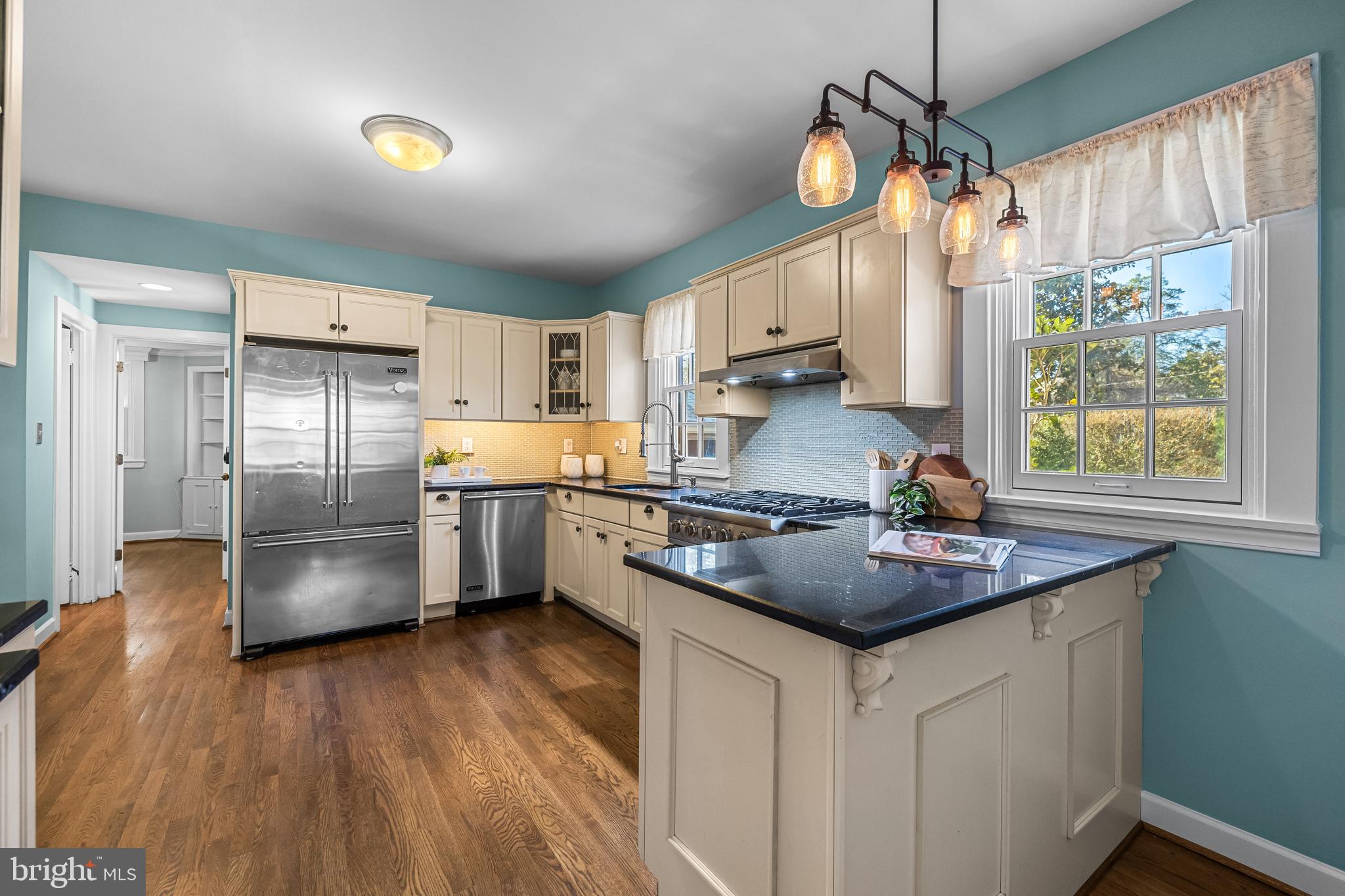 307 East Highfield Road Baltimore, MD 21218 - Photo 23 of 59 a kitchen with stainless steel appliances granite countertop a sink a stove and a refrigerator