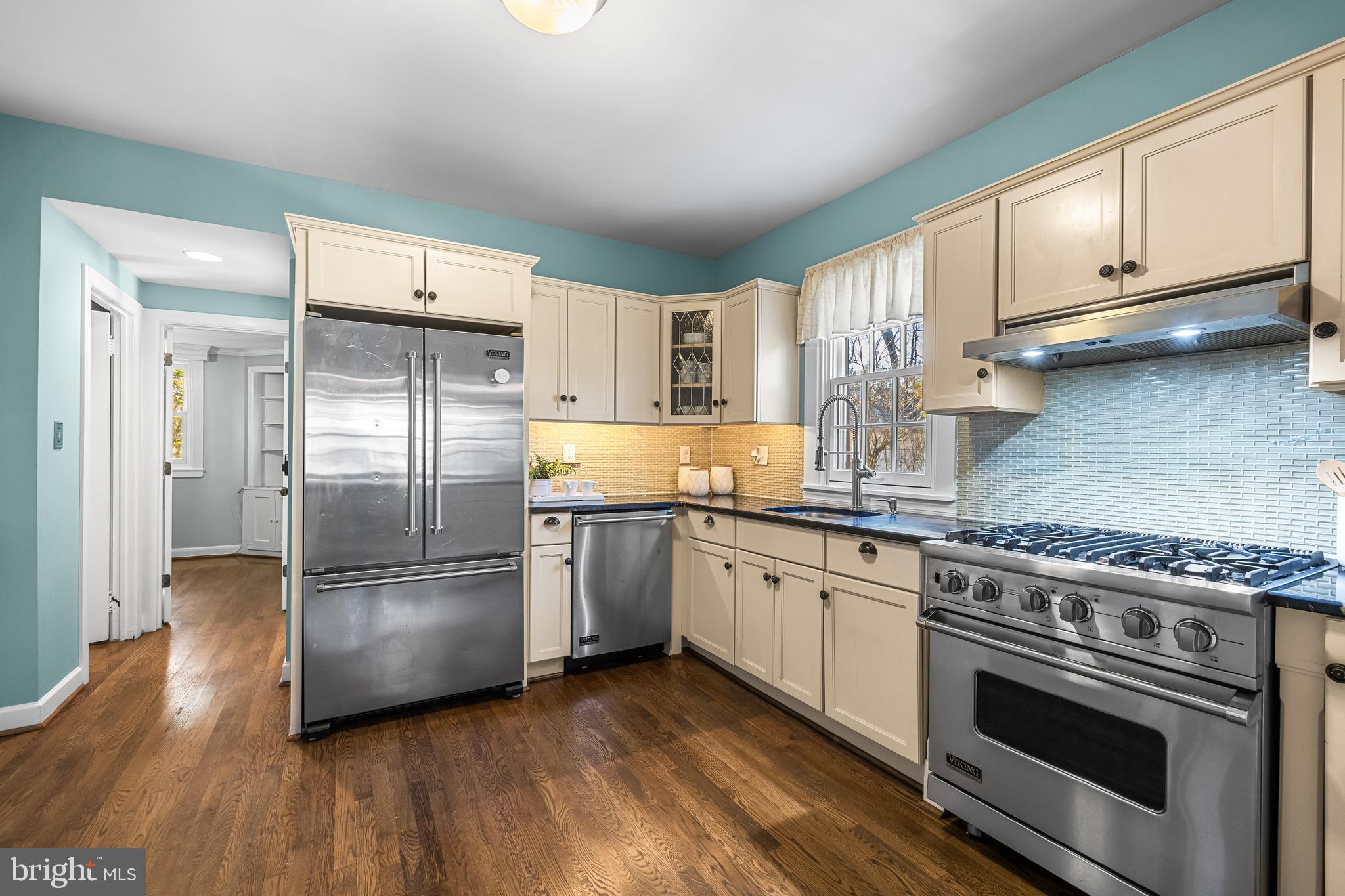 307 East Highfield Road Baltimore, MD 21218 - Photo 24 of 59 a kitchen with stainless steel appliances granite countertop a stove a refrigerator and a microwave