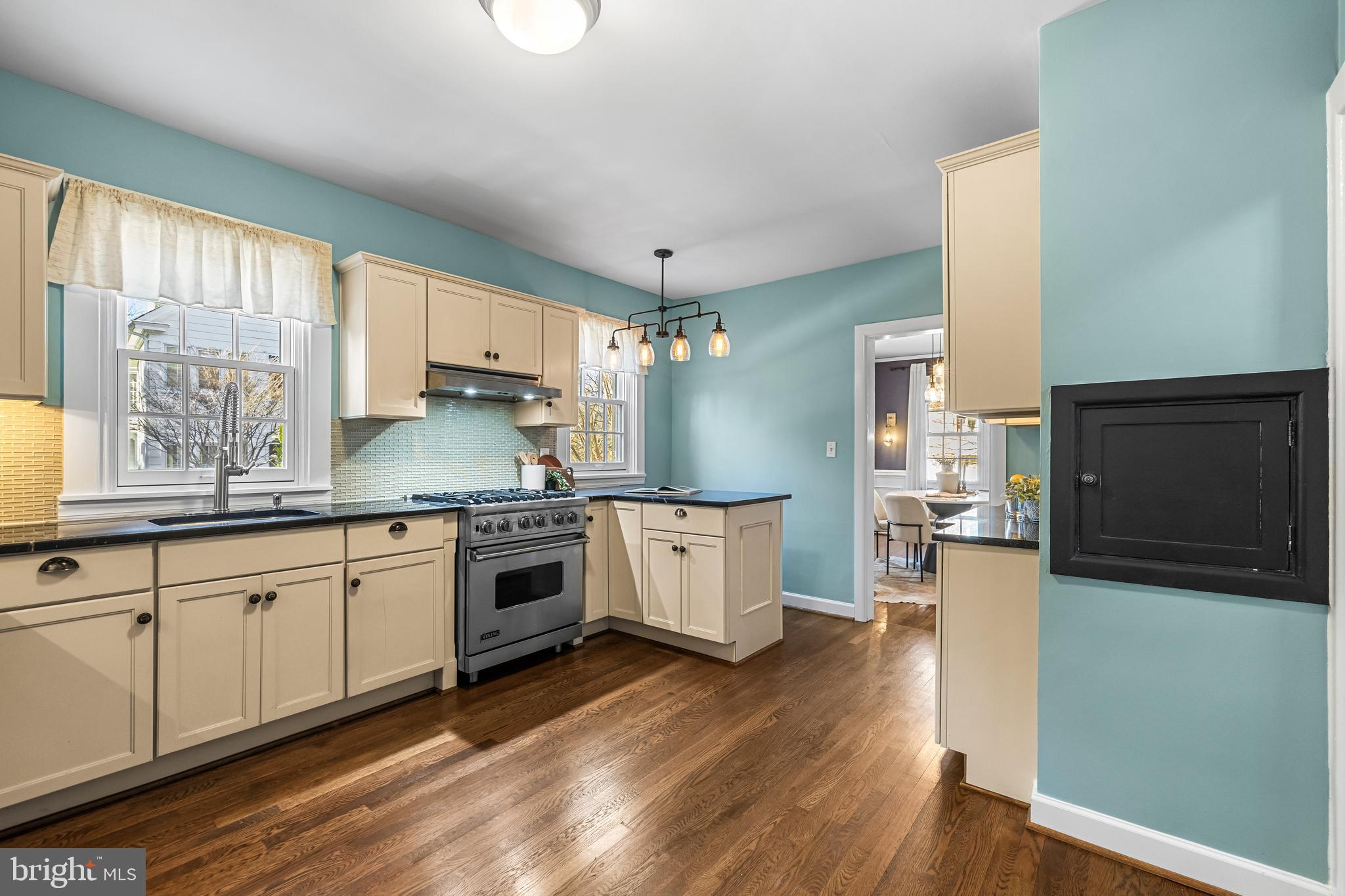 307 East Highfield Road Baltimore, MD 21218 - Photo 26 of 59 a kitchen with a stove top oven a sink a counter space and stainless steel appliances