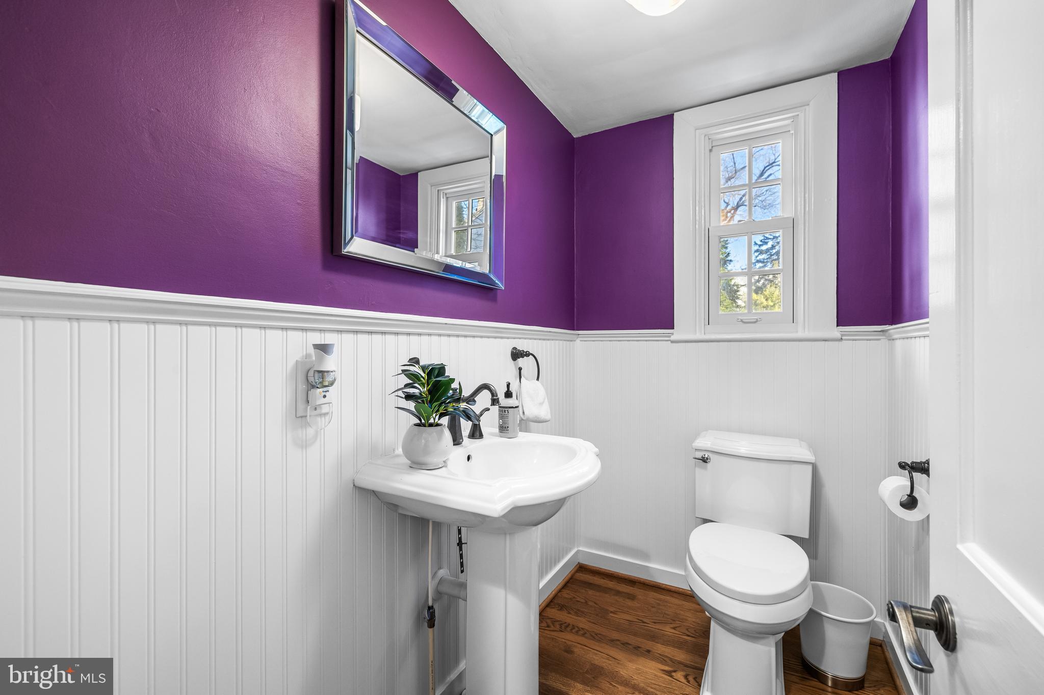 307 East Highfield Road Baltimore, MD 21218 - Photo 27 of 59 a bathroom with a toilet sink and mirror