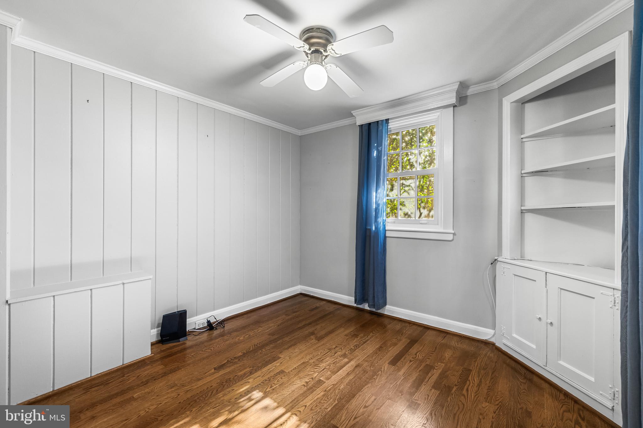 307 East Highfield Road Baltimore, MD 21218 - Photo 28 of 59 a view of empty room with wooden floor and fan