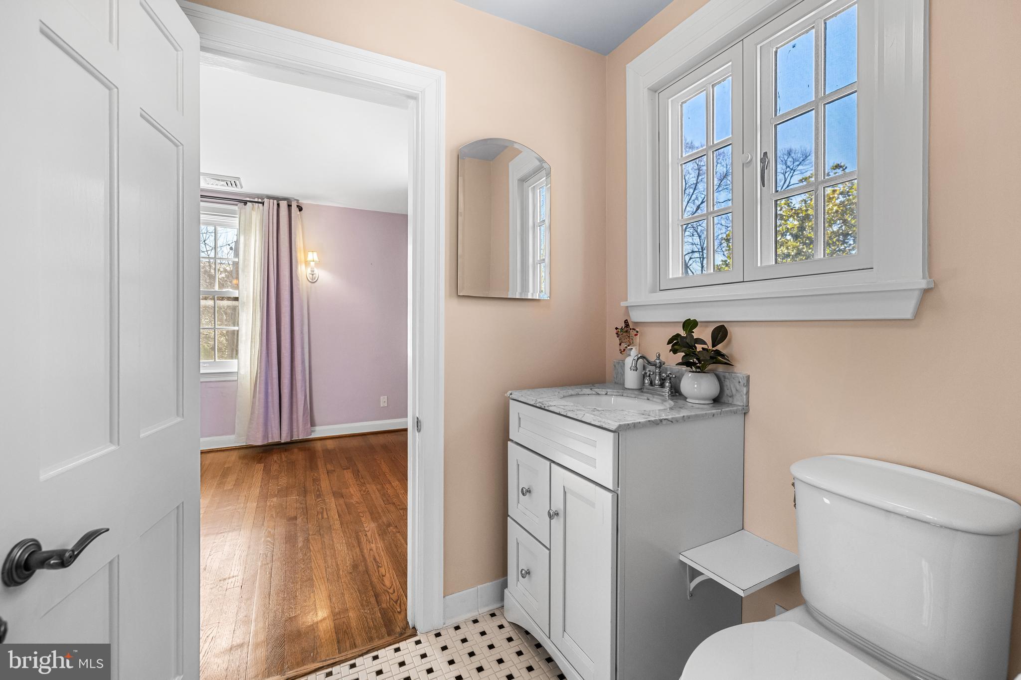 307 East Highfield Road Baltimore, MD 21218 - Photo 41 of 59 a bathroom with a toilet a sink and a mirror