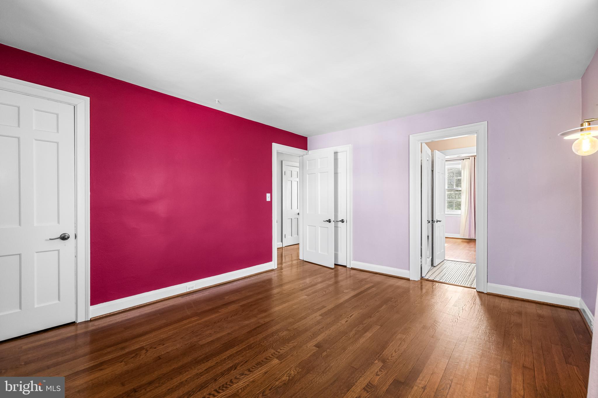 307 East Highfield Road Baltimore, MD 21218 - Photo 44 of 59 a view of an empty room with wooden floor