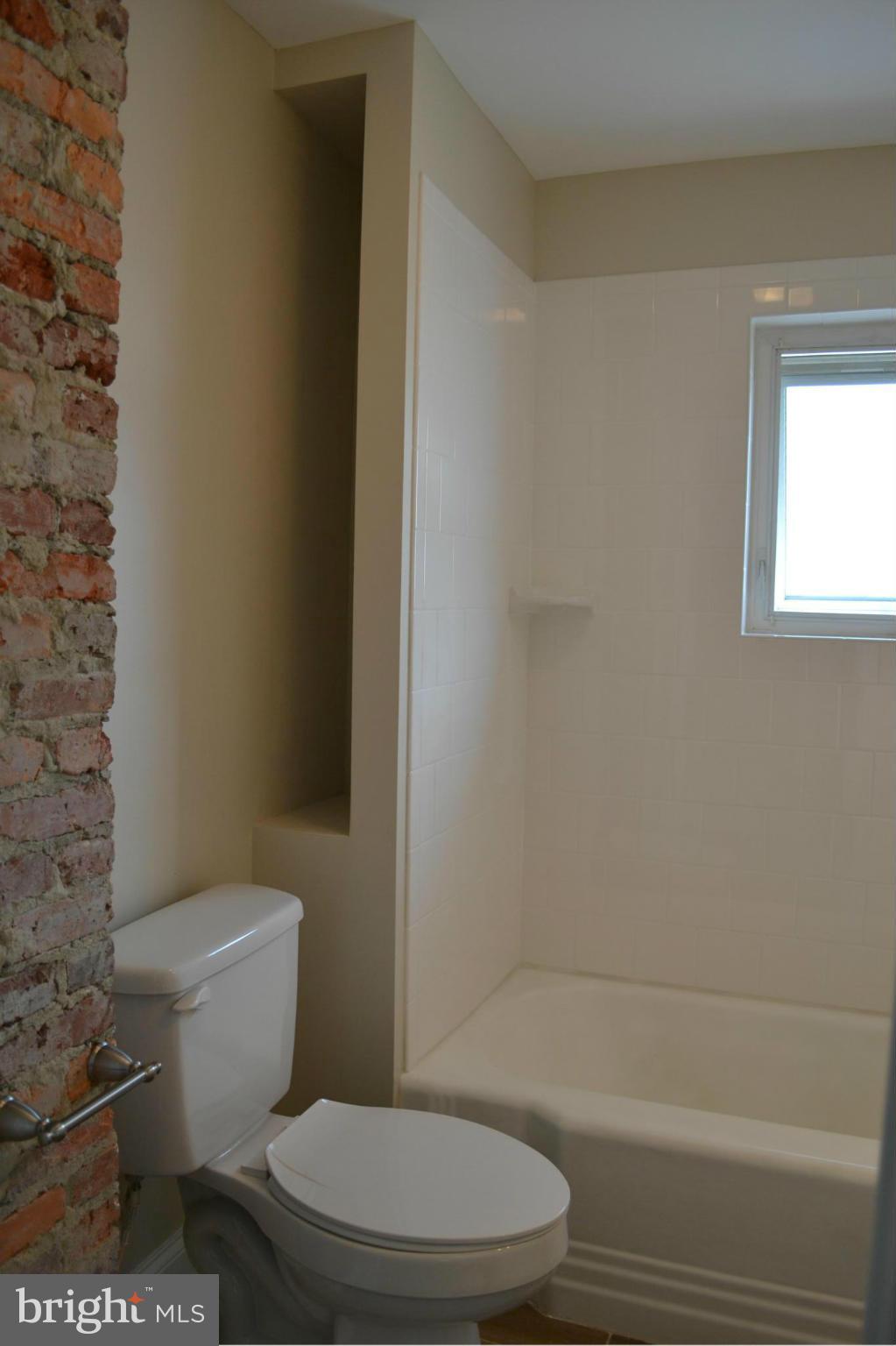 23 Eastship Road Baltimore, MD 21222 - Photo 11 of 30 a white toilet sitting next to a bath tub