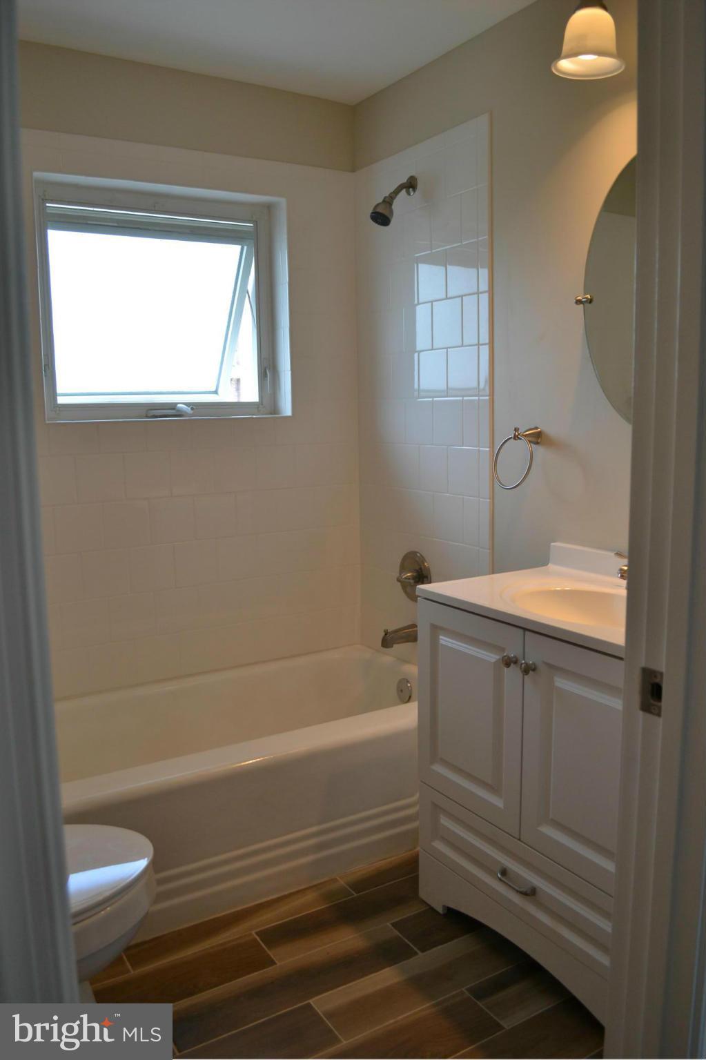 23 Eastship Road Baltimore, MD 21222 - Photo 12 of 30 a bathroom with a sink a toilet and shower