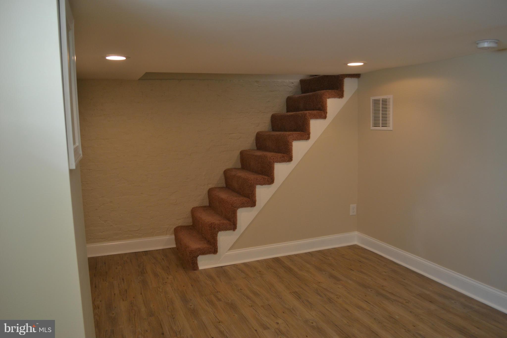 23 Eastship Road Baltimore, MD 21222 - Photo 21 of 30 wooden floor in an empty room with stairs