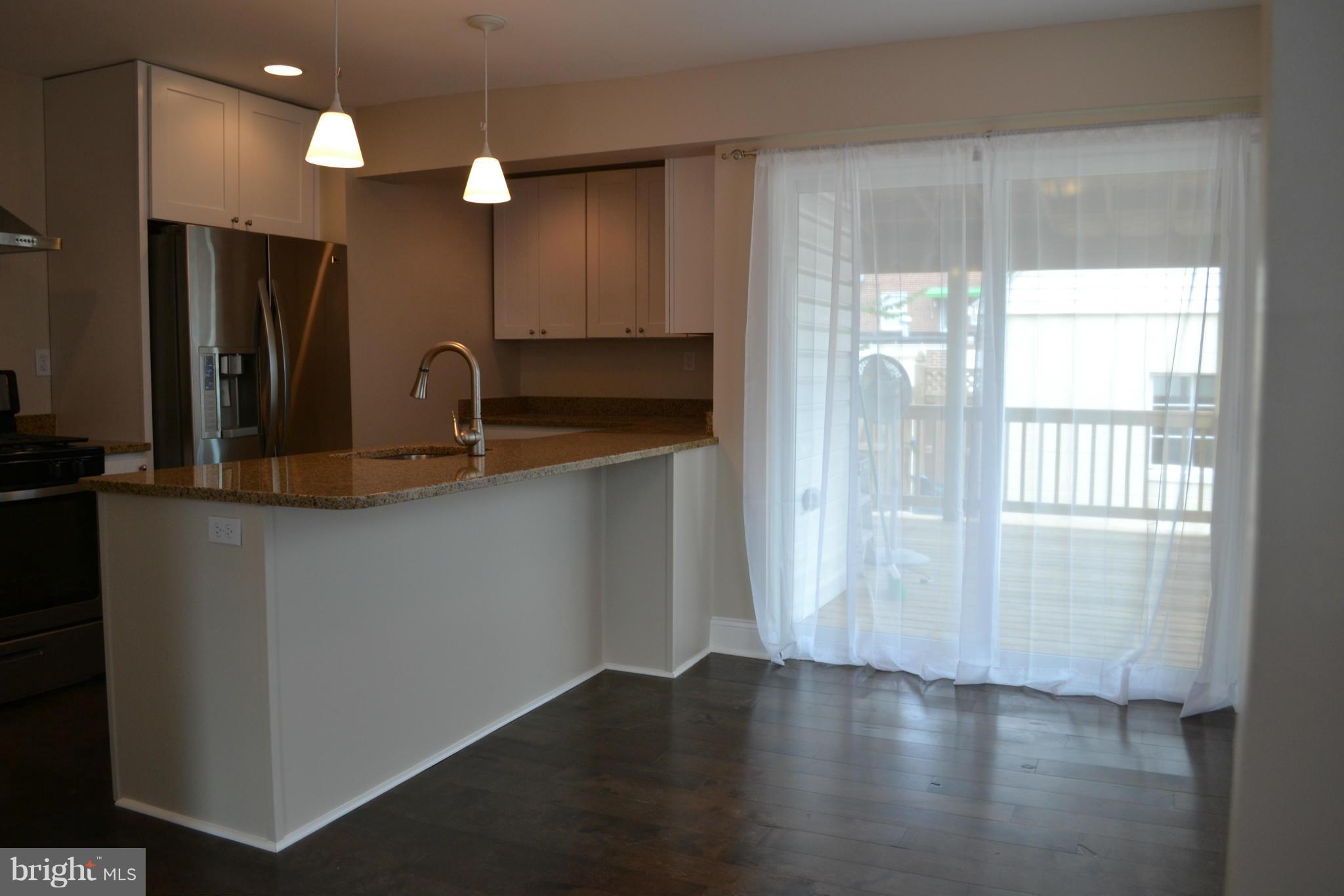 23 Eastship Road Baltimore, MD 21222 - Photo 6 of 30 a view of a kitchen with a sink and a large window