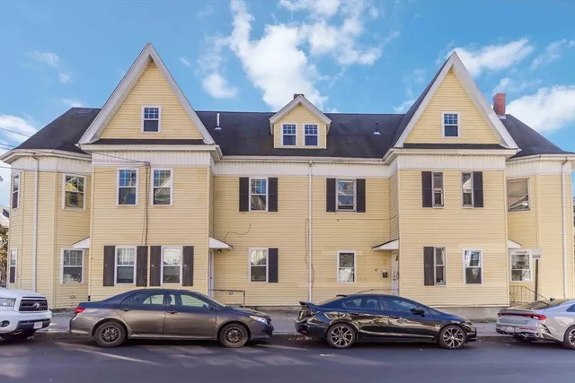 a view of a car parked in front of a house
