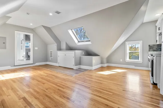 a kitchen with stainless steel appliances granite countertop a stove and a refrigerator