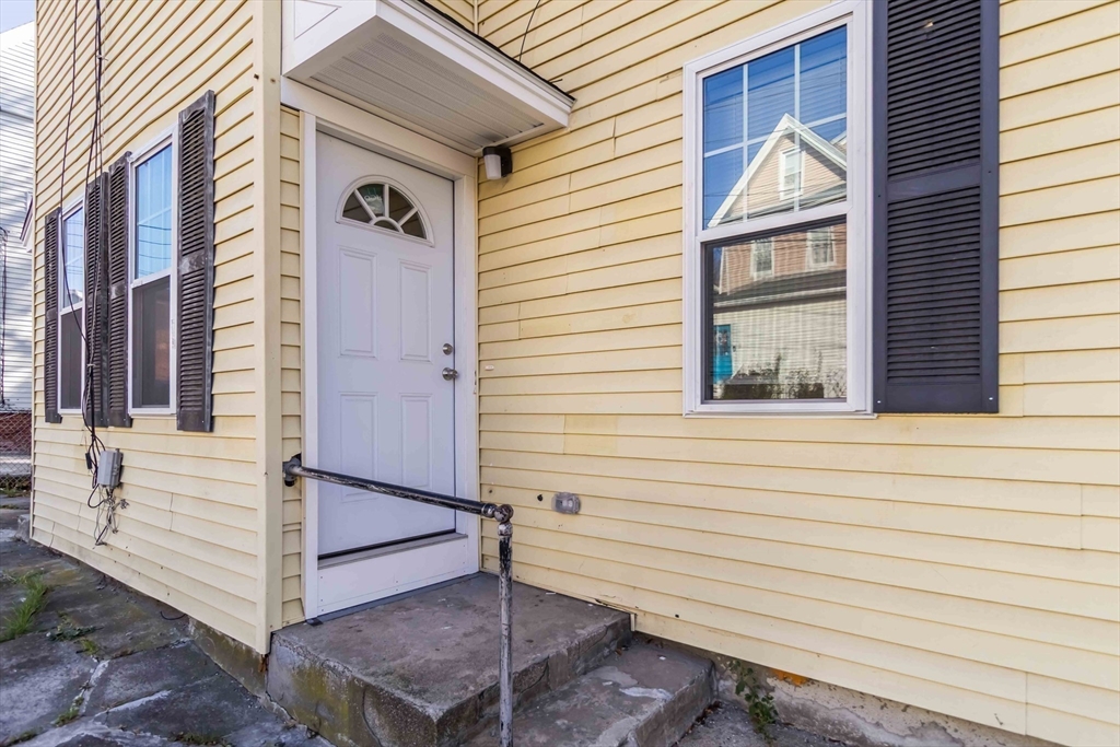 51 Mansfield Street, Unit 49 Everett, MA 02149 - Photo 30 of 31 a view of a house with a balcony