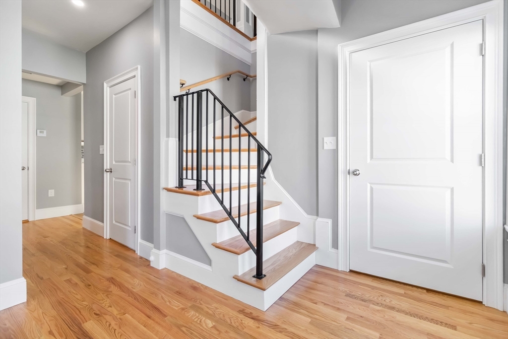 51 Mansfield Street, Unit 49 Everett, MA 02149 - Photo 6 of 31 a view of an entryway with wooden floor and door