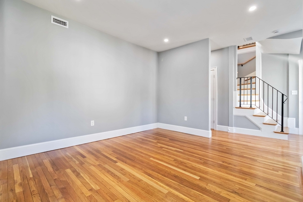 51 Mansfield Street, Unit 49 Everett, MA 02149 - Photo 10 of 31 a view of an empty room with wooden floor