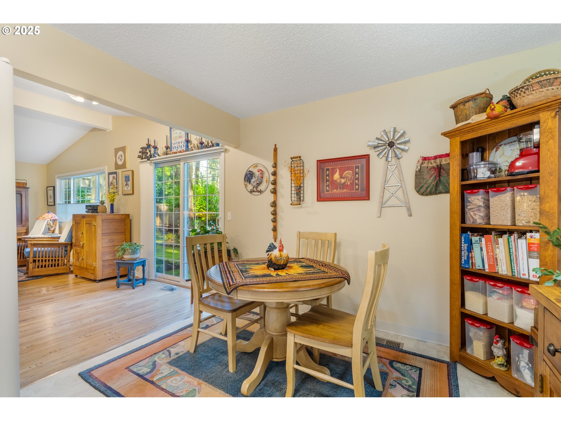 16808 Southwest Inverurie Road Lake Oswego, OR 97035 - Photo 13 of 38 a dining room with furniture and a book shelf