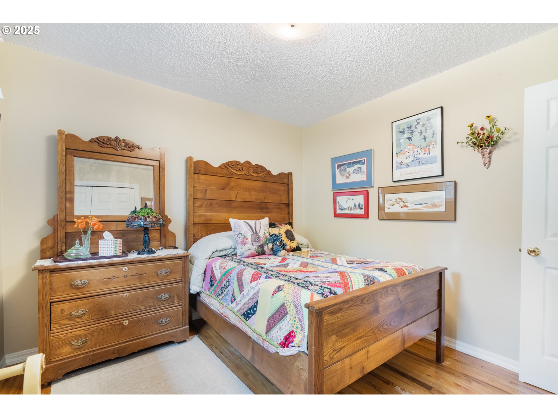 16808 Southwest Inverurie Road Lake Oswego, OR 97035 - Photo 24 of 38 a bed room with a bed and a dresser