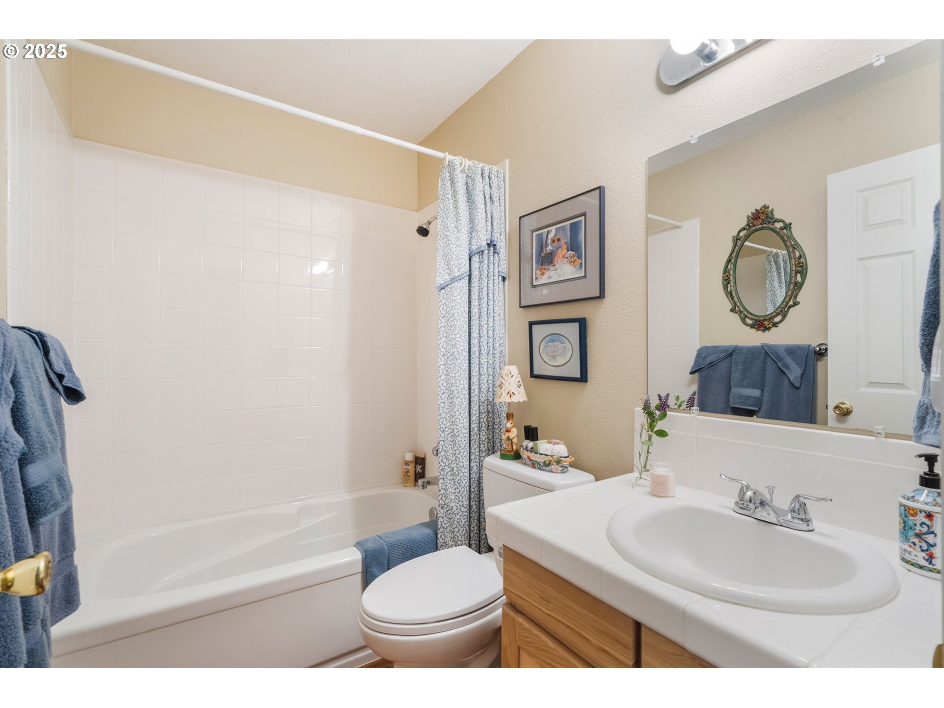 16808 Southwest Inverurie Road Lake Oswego, OR 97035 - Photo 26 of 38 a bathroom with a sink toilet and shower
