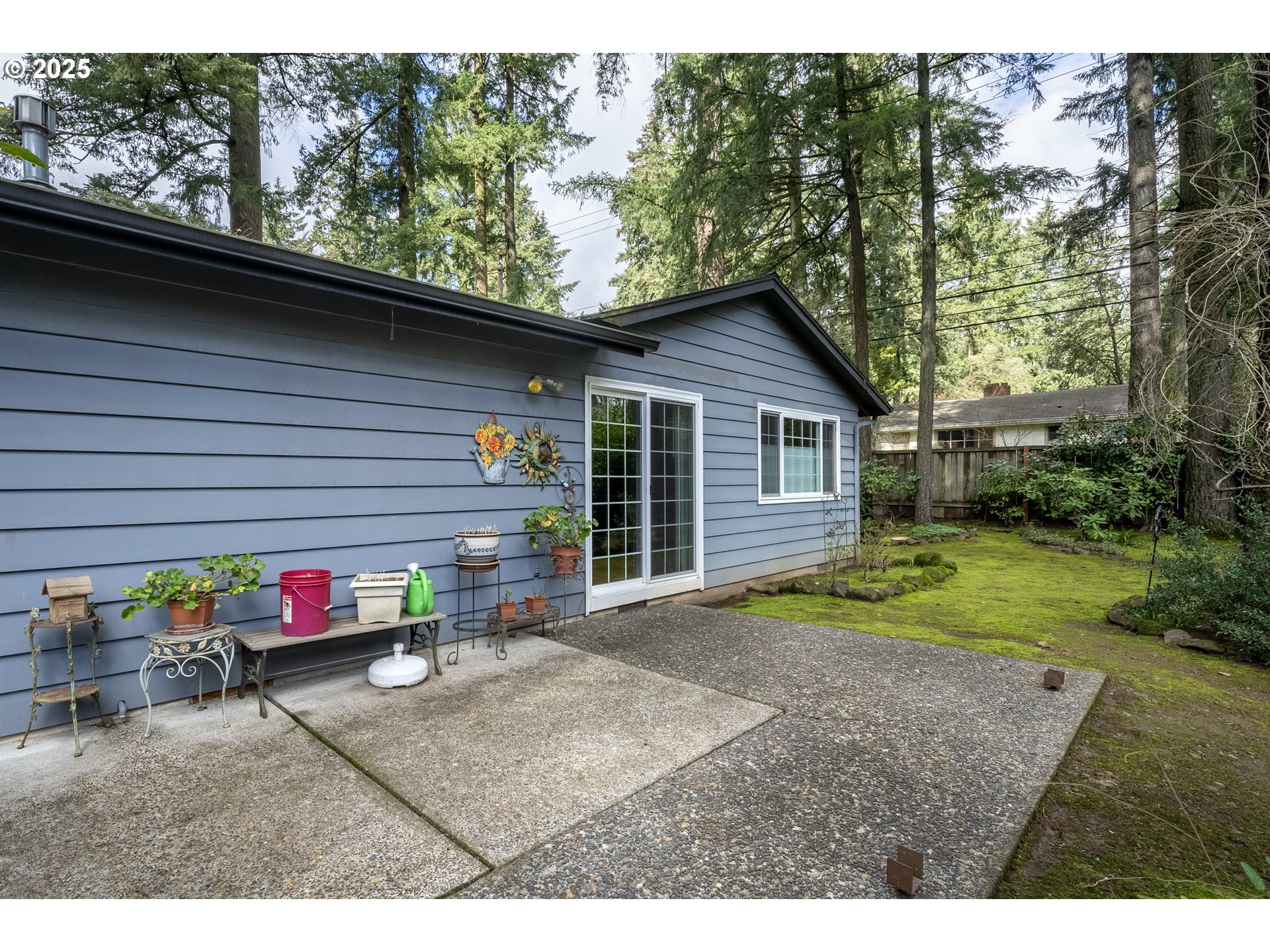 16808 Southwest Inverurie Road Lake Oswego, OR 97035 - Photo 32 of 38 a yellow and red house sitting in front of a yard
