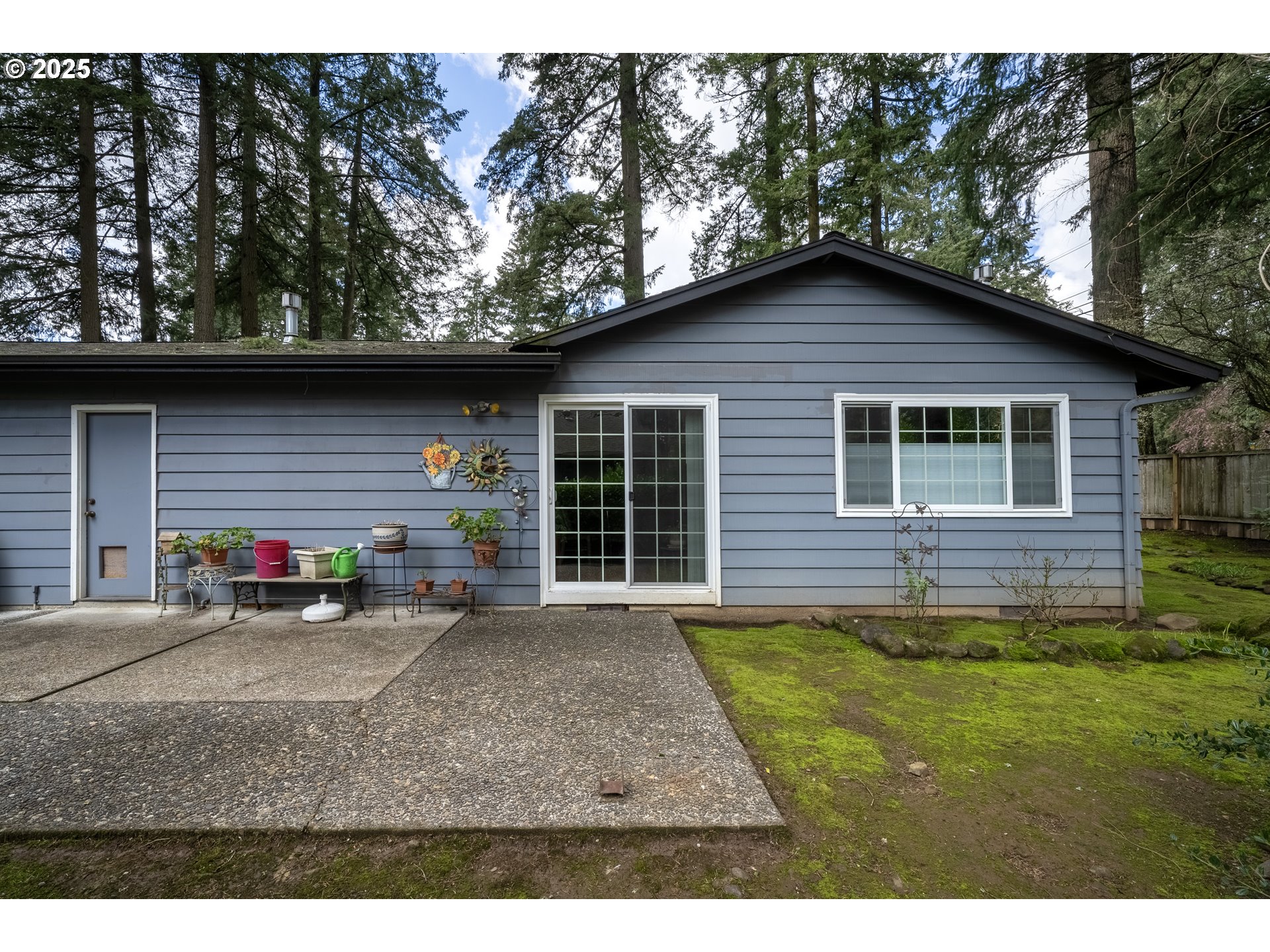 16808 Southwest Inverurie Road Lake Oswego, OR 97035 - Photo 33 of 38 a view of a house with a patio